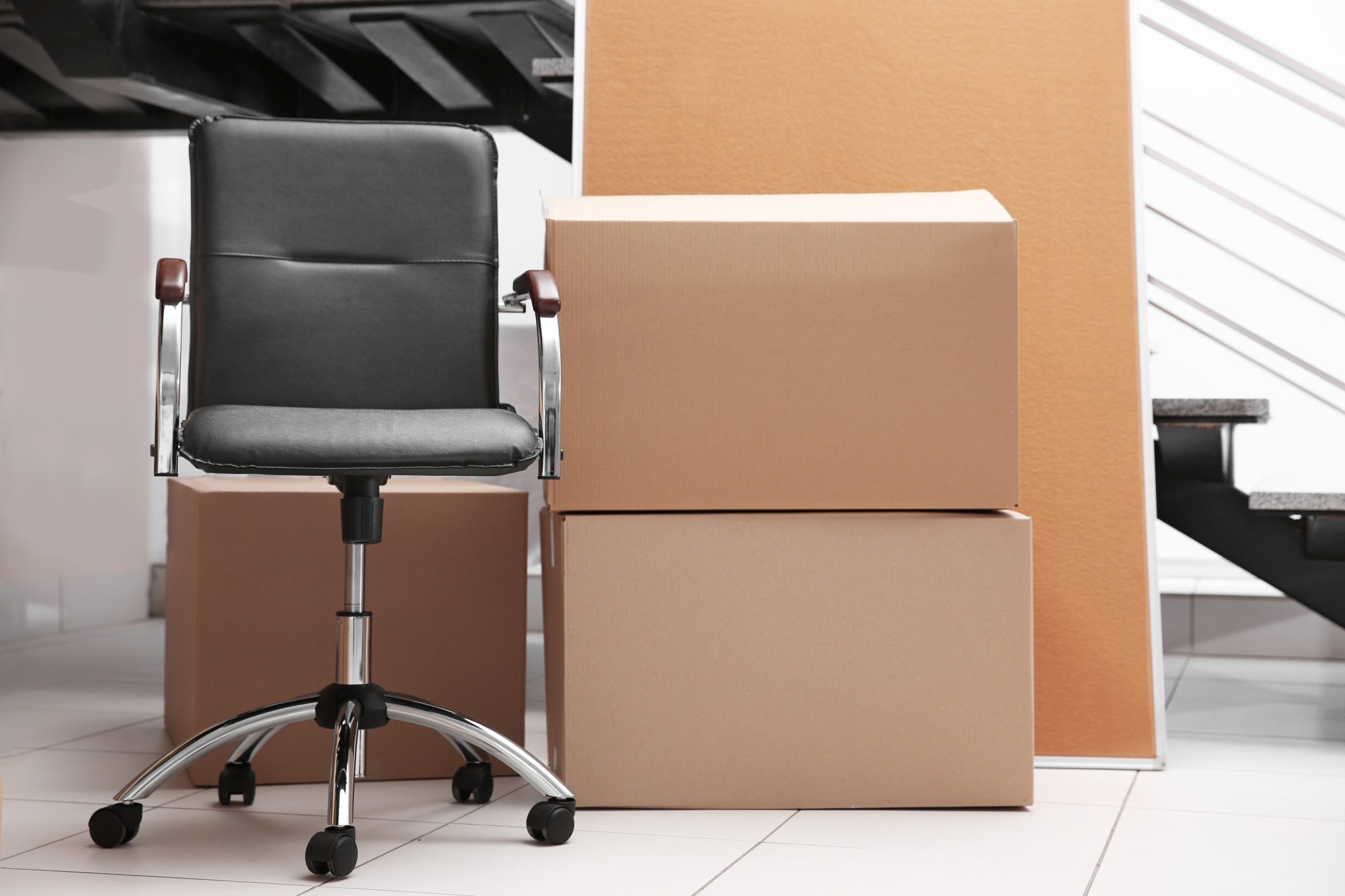 Move concept. Unpacking cardboard boxes in a new office