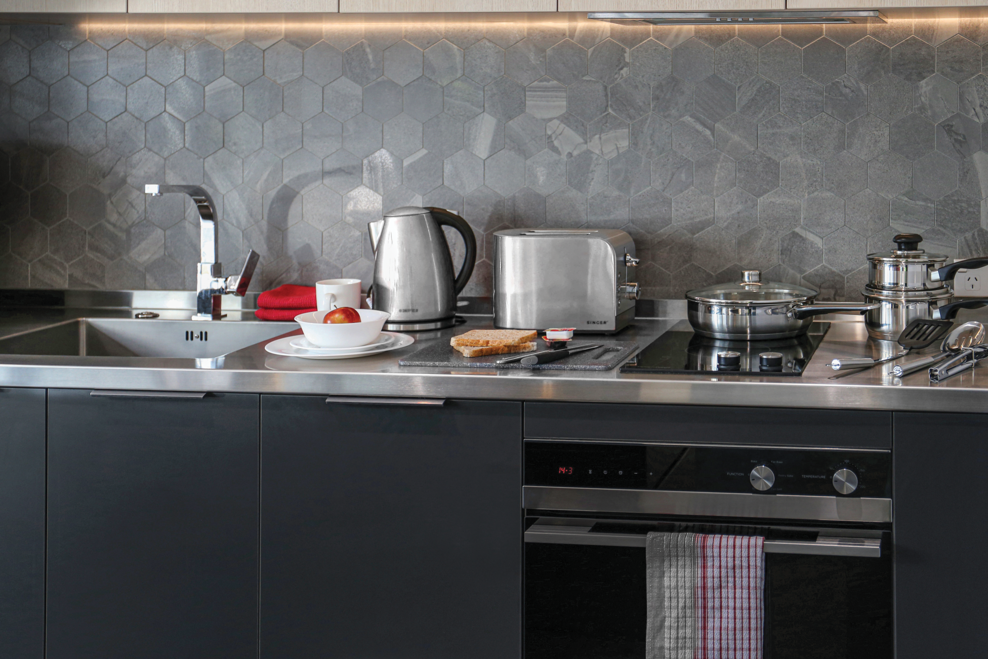Durable commercial-grade kitchenware set up in a motel kitchenette